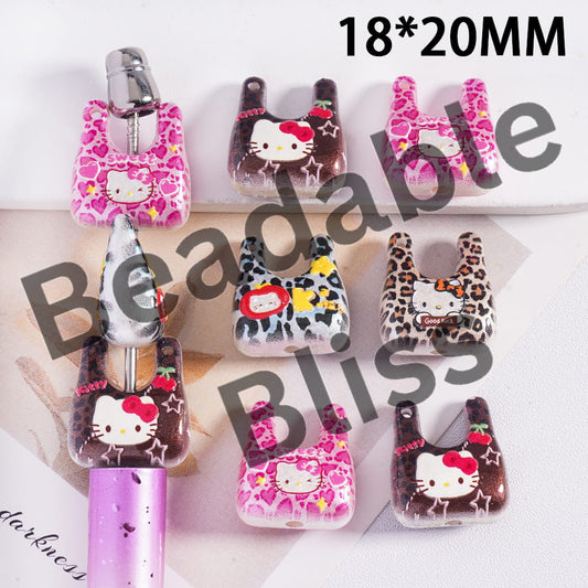 Set of small Hello Kitty-themed pouches with various designs on a white background.