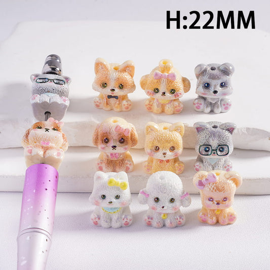 Set of small animal figurines with a pen on a white background, featuring height measurement.
