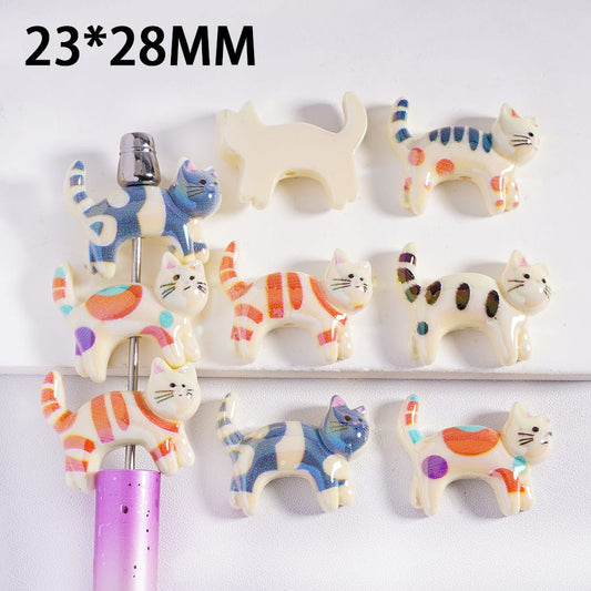 Set of cat-shaped ceramic items on a white background with dimensions 23*28MM.
