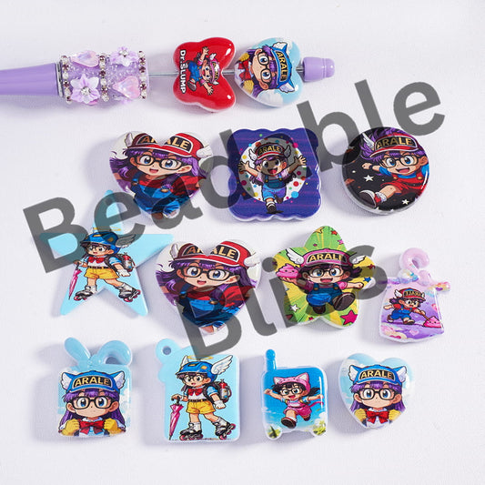 Collection of colorful character-themed hair ties on a white background