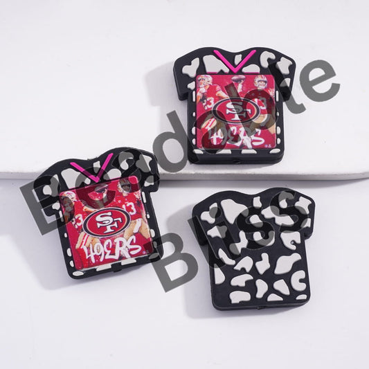 Three decorative pins with San Francisco 49ers logo on a white background