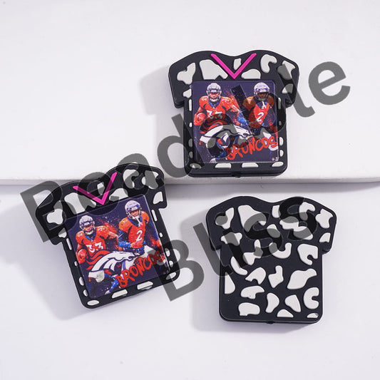 Two black and white patterned keychains with images of football players and 'Broncos' text on a white background.