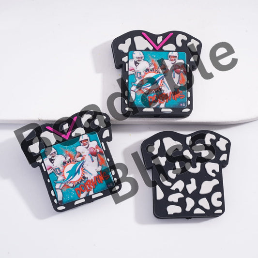 Three decorative magnets with football-themed designs on a white background.