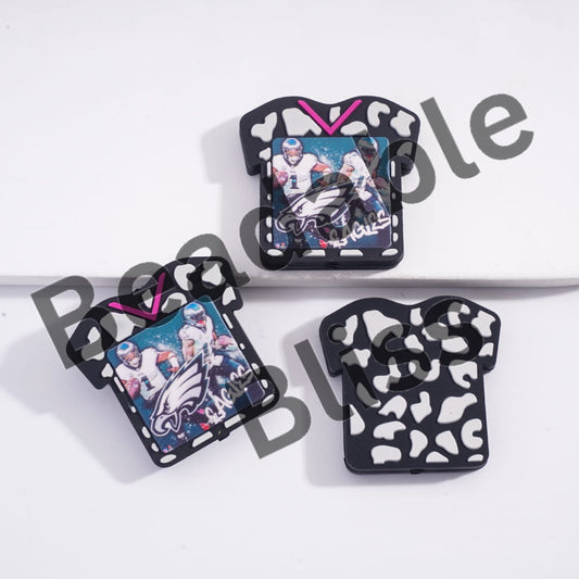 Three small pouches with football-themed designs on a white background, branded 'handsome supply'.