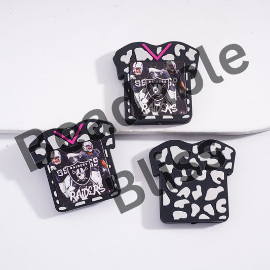 Three decorative items shaped like sports jerseys with player images and 'Raiders' text on a white background.