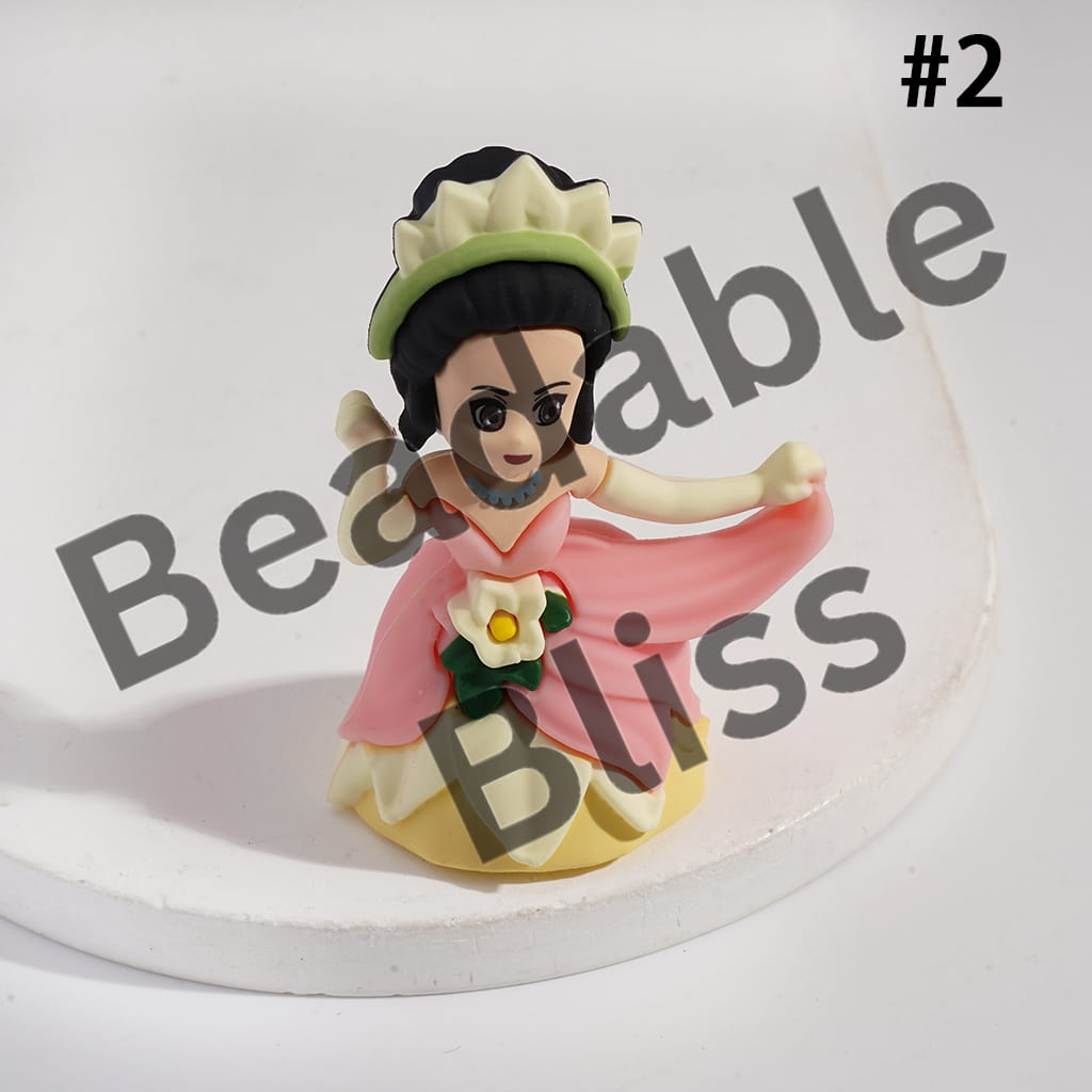 Figurine of a character in a pink dress with a green headband on a white background, branded 'handsontupply.com'.