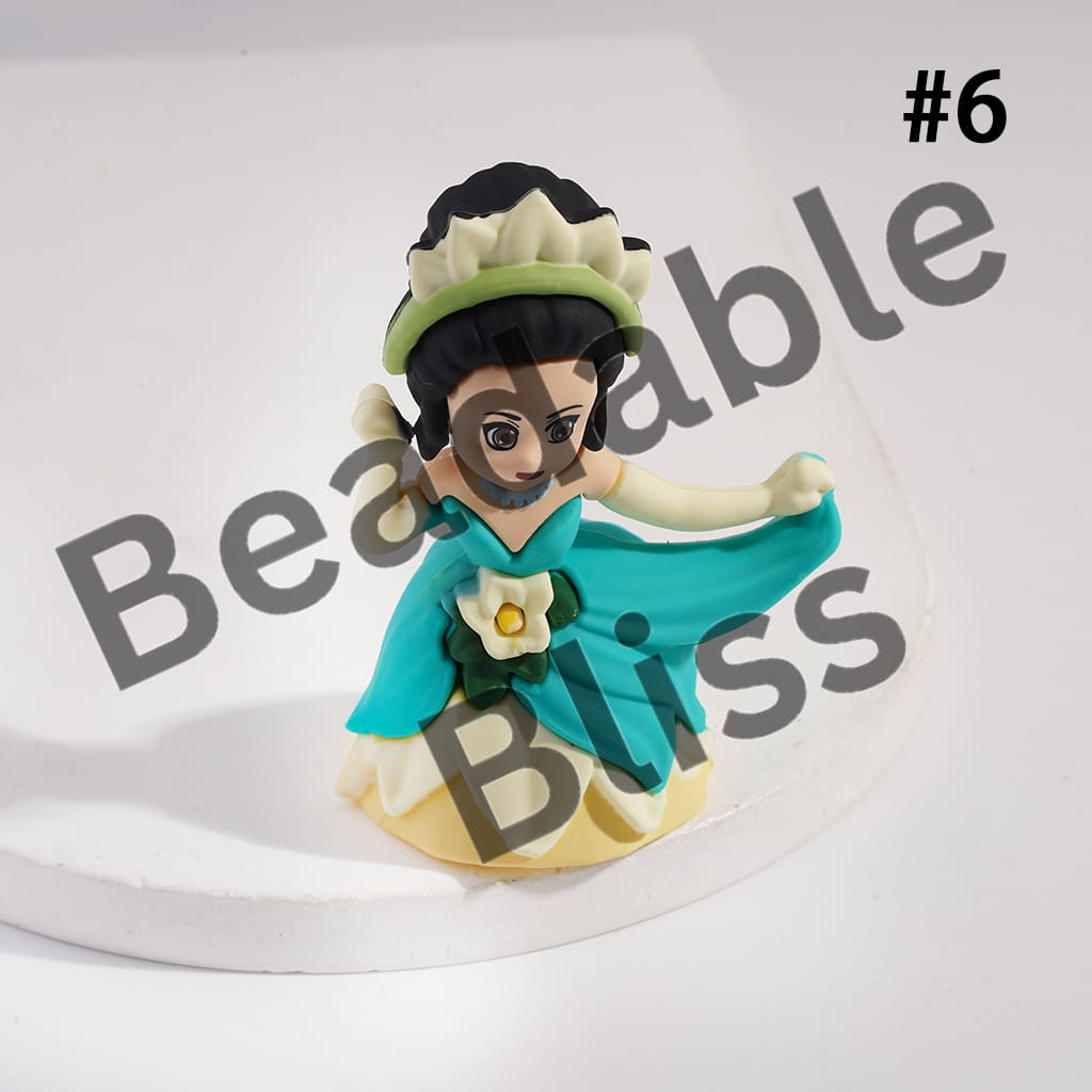 Figurine with green headband and blue scarf on a white background, branded 'handsontosupply.com'.