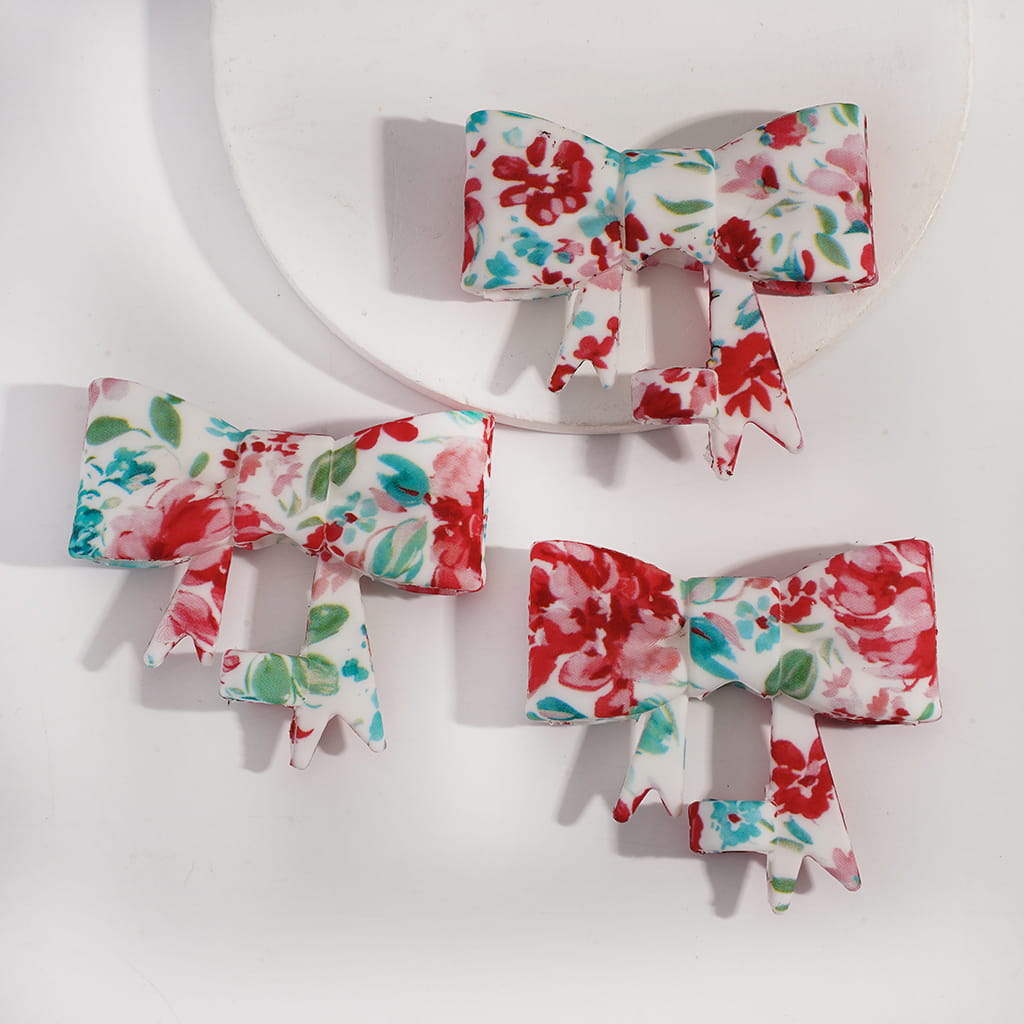 Floral-patterned hair bows on a white background

