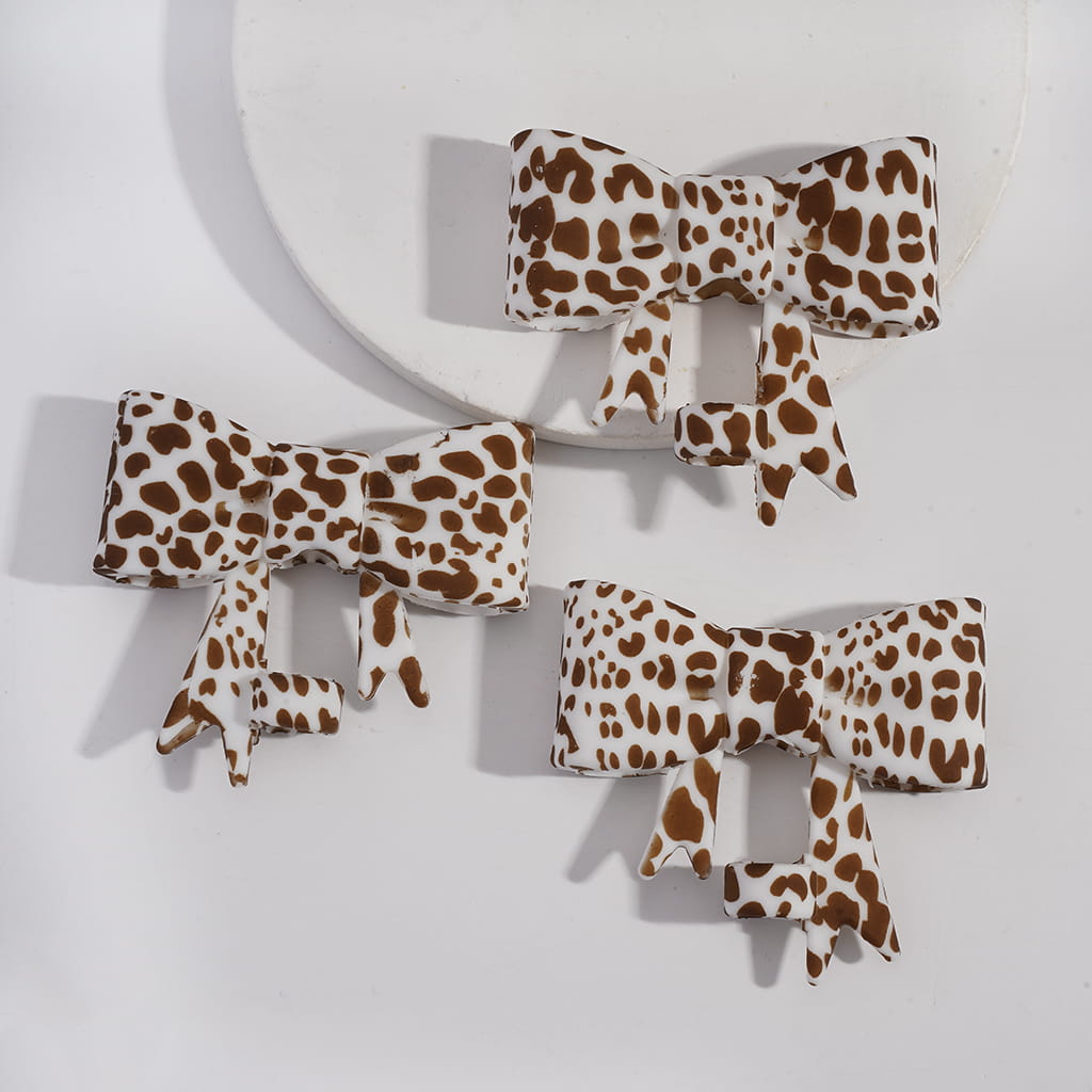 Set of leopard print hair bows on a white background