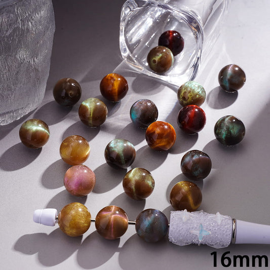 Multicolored beaded necklace with a clear glass container on a light gray surface