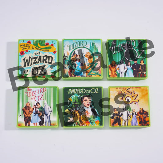 Six different 'The Wizard of Oz' themed coasters on a white background.