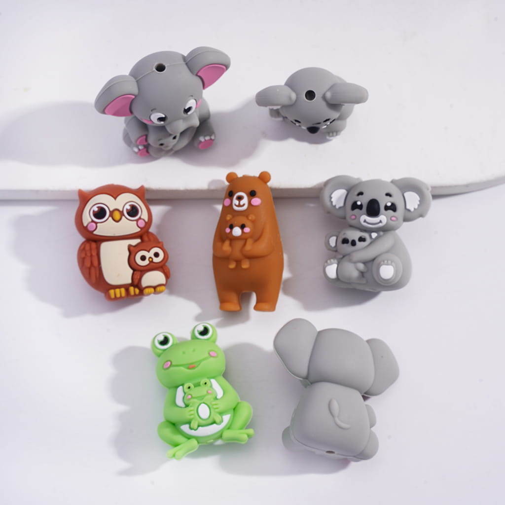 Set of animal-shaped cable protectors on a white background