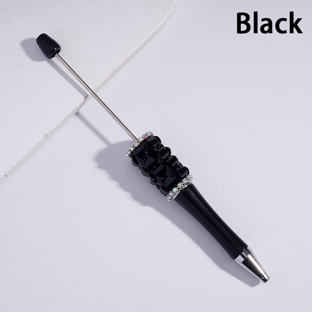 Black pen with decorative elements on a light gray background
