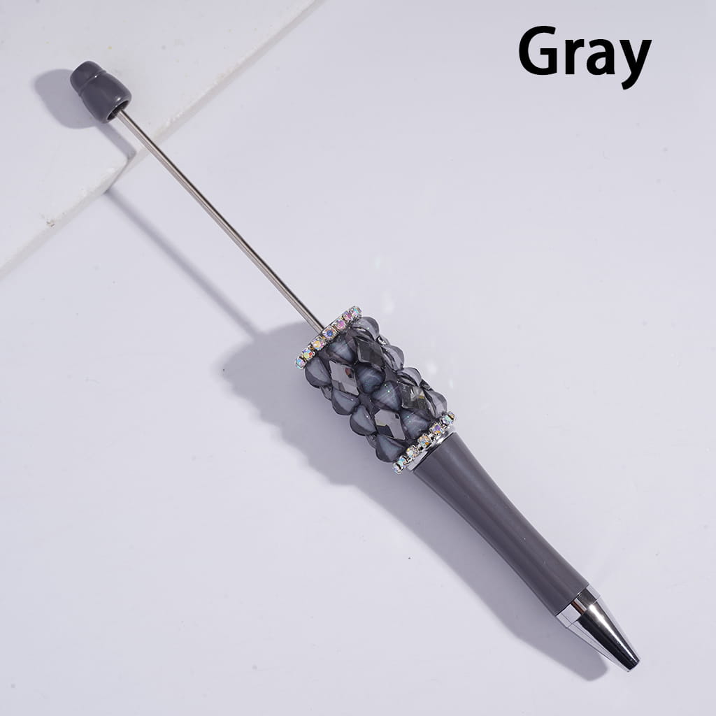 Gray pen with decorative top on a light gray background