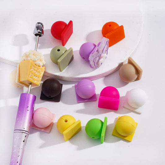 Colorful stationery items including a pen and various shaped erasers on a white background
