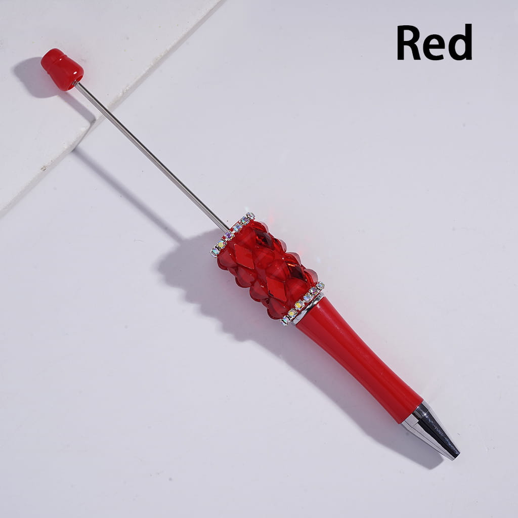 Red pen with decorative elements on a white background