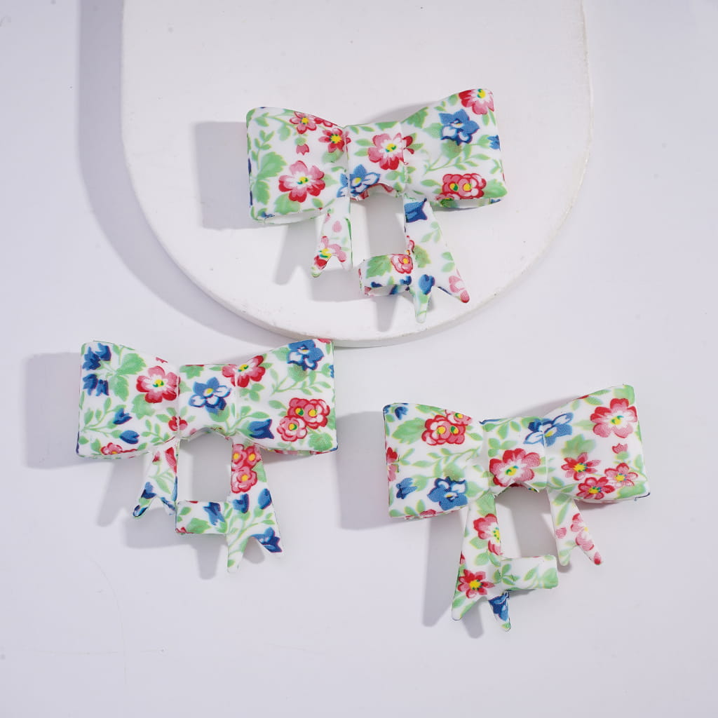 Set of floral hair bows on a white background