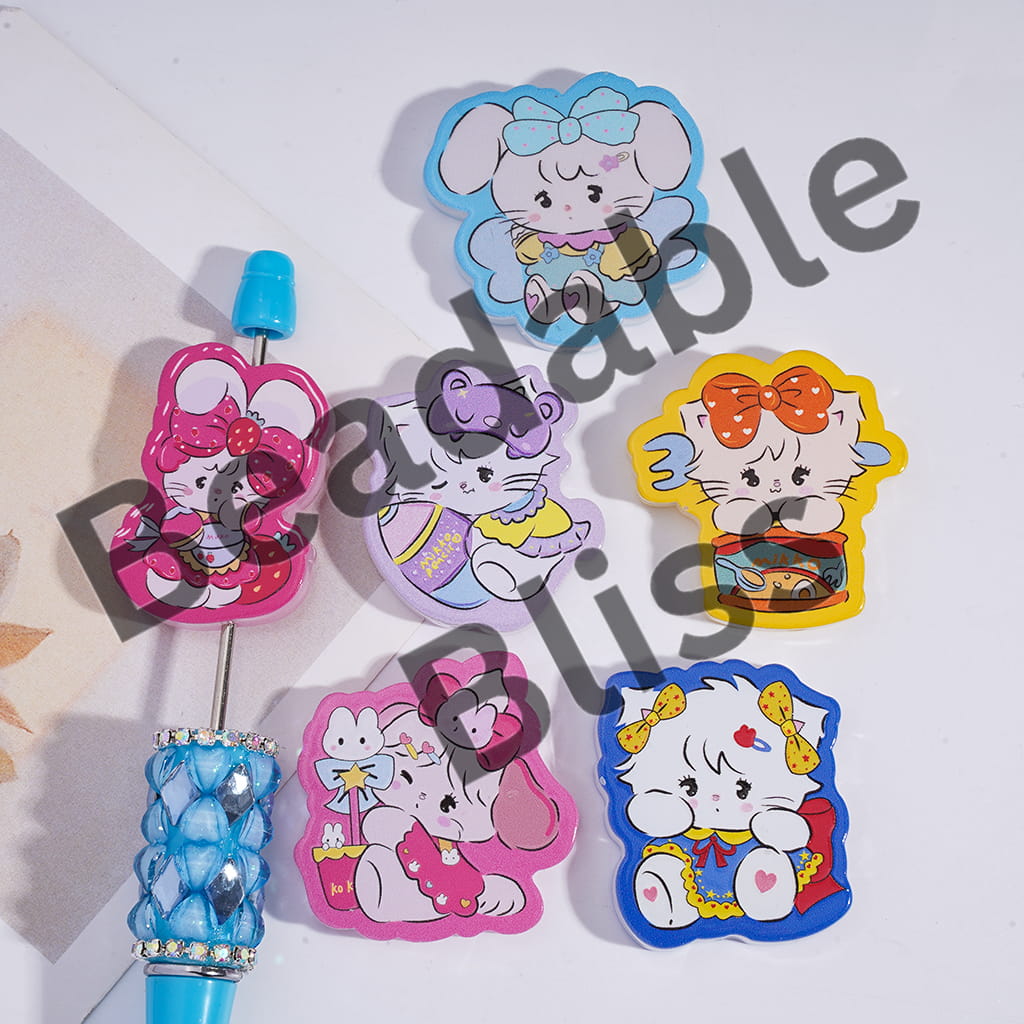 Set of colorful cartoon character pins on a white background