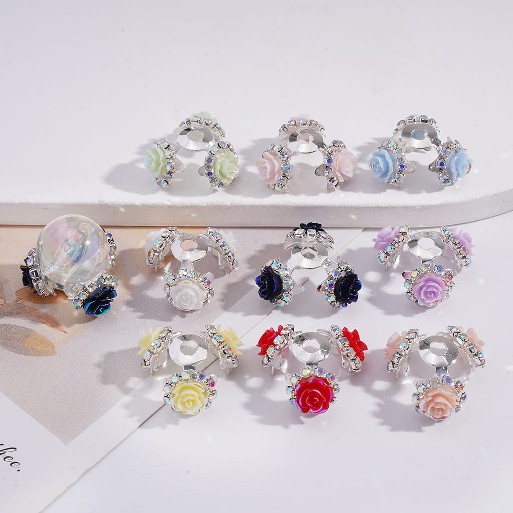 Set of decorative hair clips with floral designs on a white background