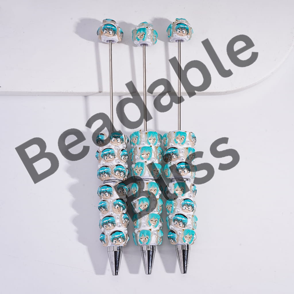 Beaded pen with character design on a white background, featuring the brand 'Beadable Bliss'.