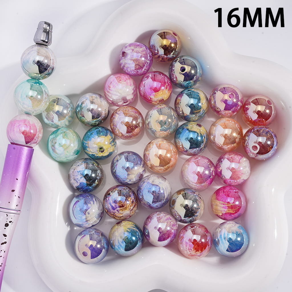 Colorful round beads with a 16MM size on a white plate

