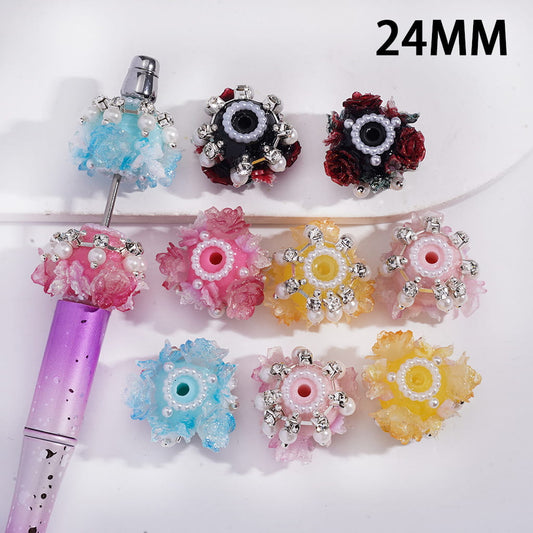 Decorative beads with floral designs and crystals on a white background, labeled '24MM'.