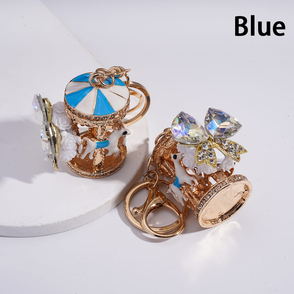 Decorative keychain with blue and gold design on a white background
