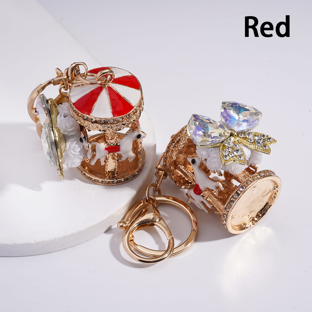 Decorative keychain with carousel design on a white background