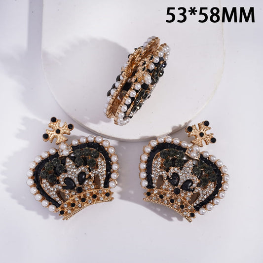 Decorative earrings with heart design and pearl accents on a white background