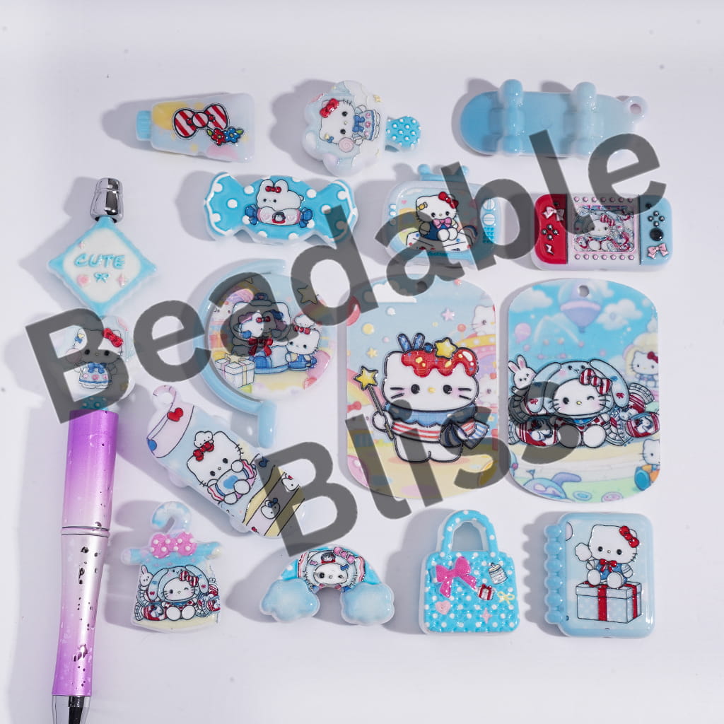 Collection of Hello Kitty-themed stationery items on a white background with 'handconsupply.com' branding.