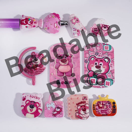 Collection of pink cartoon-themed accessories on a white background