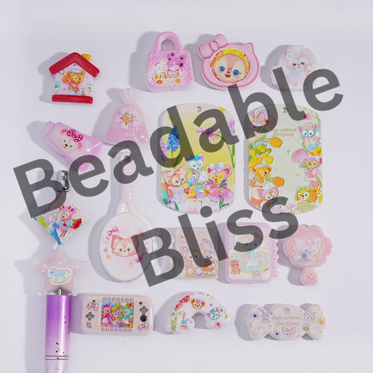 Collection of colorful stationery items with cartoon designs on a white background, featuring the brand 'handsontosupply.com'.