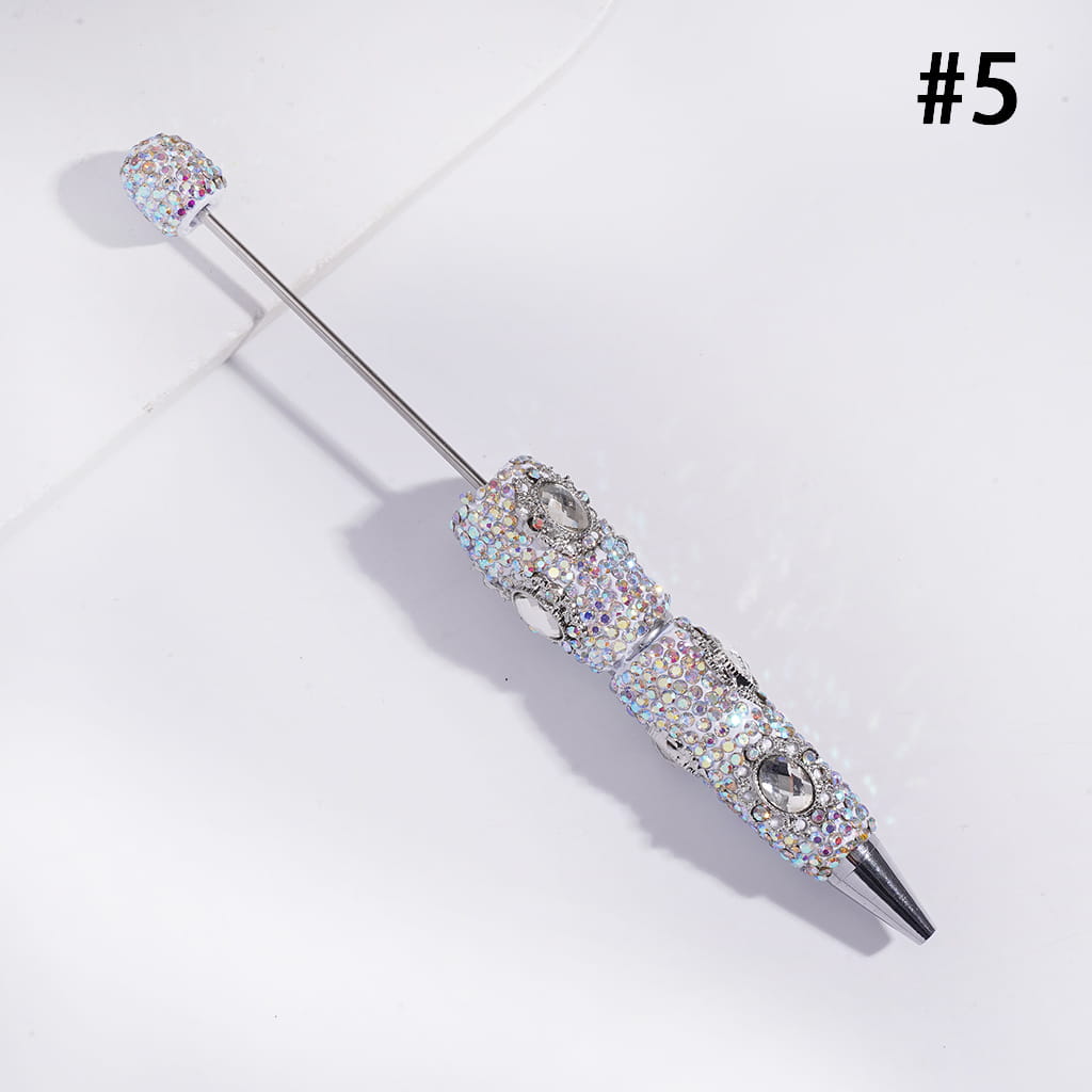Decorative brooch with crystal embellishments on a light gray background