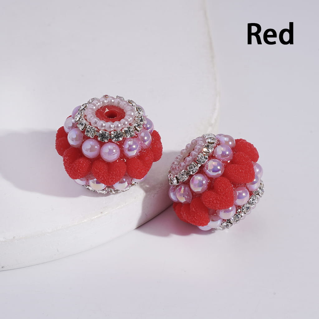 Pair of red and pink beaded earrings on a white background with 'Red' text.