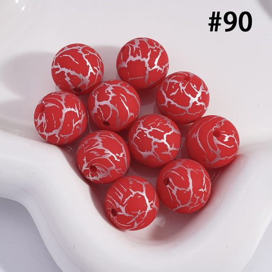 Red marbled beads on a white dish with the number 90.