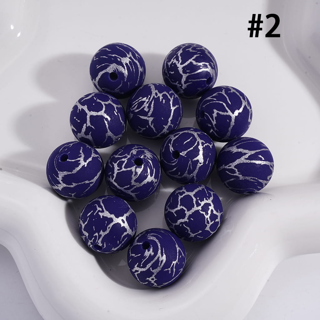 Blue marbled beads on a white surface