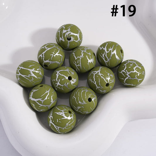 Green marbled beads on a white background