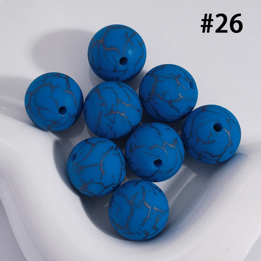 Blue marbled beads on a white background with the number 26.