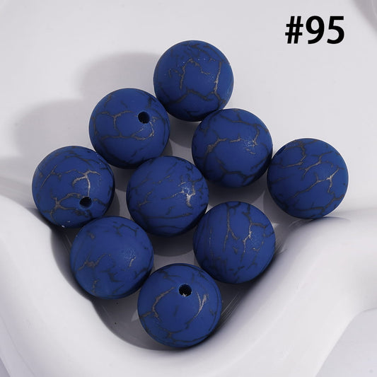 Blue marbled beads on a white background