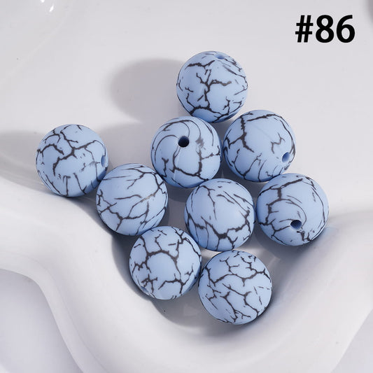 Blue marbled beads on a white background