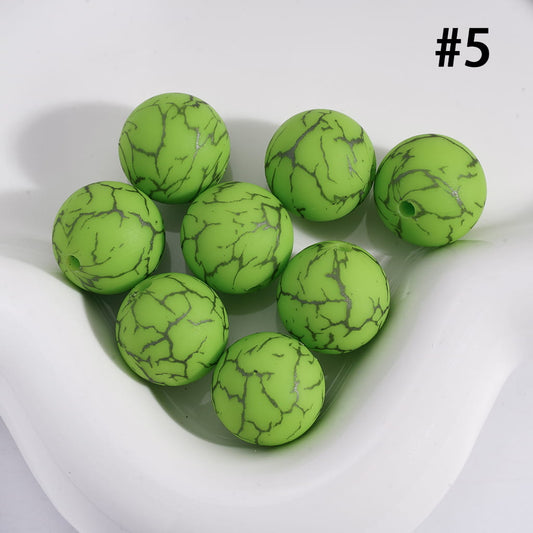 Green marbled beads on a white background