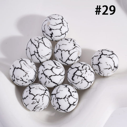 White marbled beads on a white background