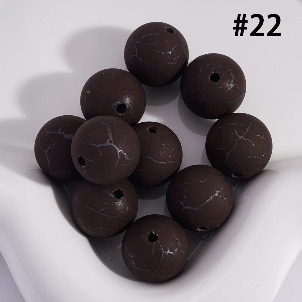 Brown marbled beads on a white background with number 22