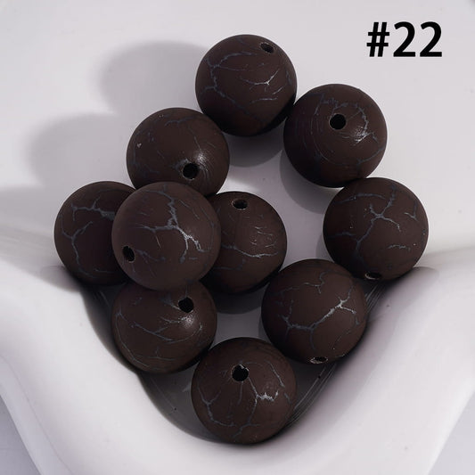 Brown marbled beads on a white background with number 22
