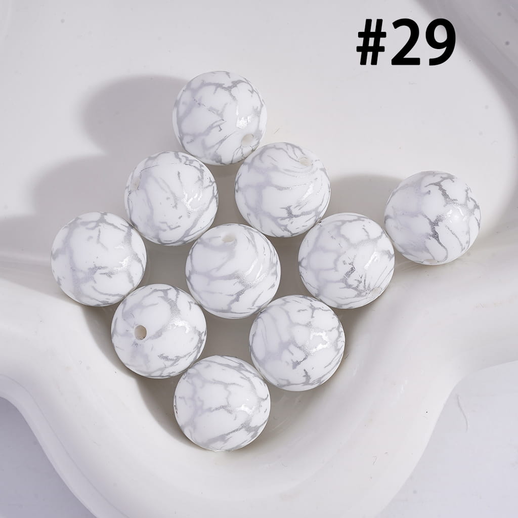 White marbled beads on a light background
