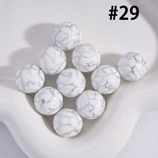 White marbled beads on a light background