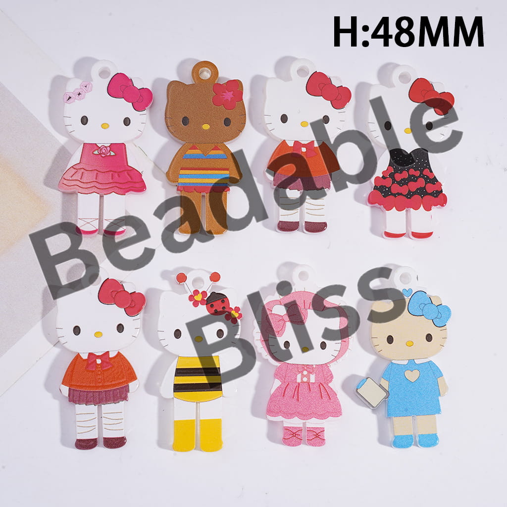 Colorful Hello Kitty character figurines with various outfits on a white background.