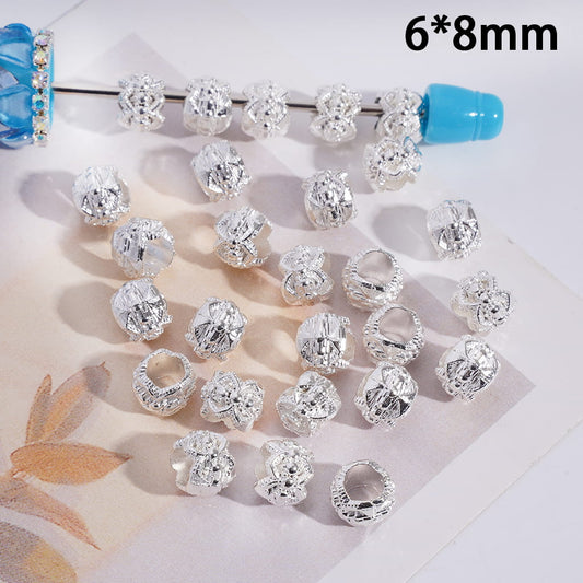 Collection of silver jewelry beads on a white surface with '6*8mm' text.