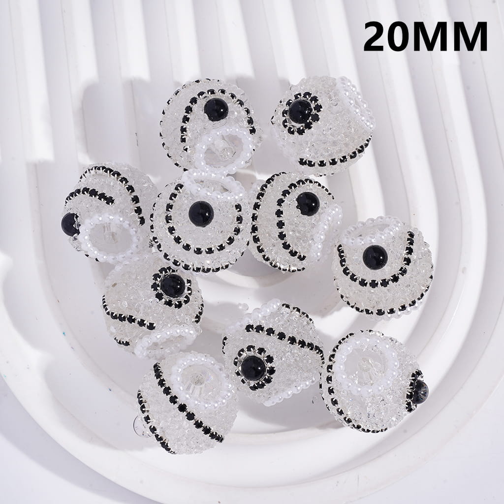 Close-up of decorative beads with black centers on a white background, labeled '20MM'.