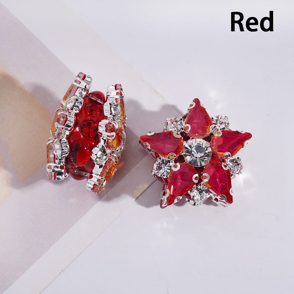 Red and silver earrings on a light background
